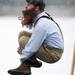 A member of the Soggy Bottom Boys cannonballs into Ford Lake on Saturday, Feb. 16. Daniel Brenner I AnnArbor.com